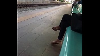 Flip flops play in the train station platform